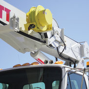 A Spring-Driven Reel is used for power transmission on a bucket truck