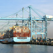 Ship in at the container terminal loaded by a STS Container Crane